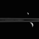Illustration for article titled Can You Find the Third Moon in this Glorious View from Saturn?